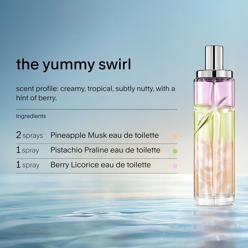 Yummy Swirl Starlicious layering recipe: tall bottle with purple, green and amber gradient on water against a soft blue background. Creamy, tropical, subtly nutty scent with a hint of berry; 2 sprays Pineapple Musk, 1 Pistachio Praline, 1 Berry Licorice.