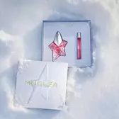 An open, textured ice-blue glistening Mugler gift set resting on snow, revealing an angel nova eau de parfum 50ml gift set