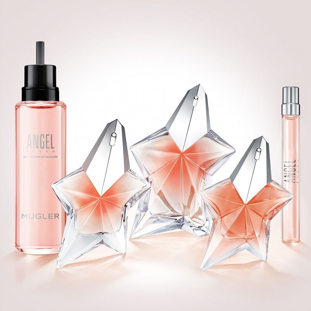 Mugler Angel Blush perfume collection with star bottles, refill bottle, and travel spray.