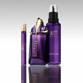 Mugler Alien perfume bottle with refill bottle and travel spray on reflective surface