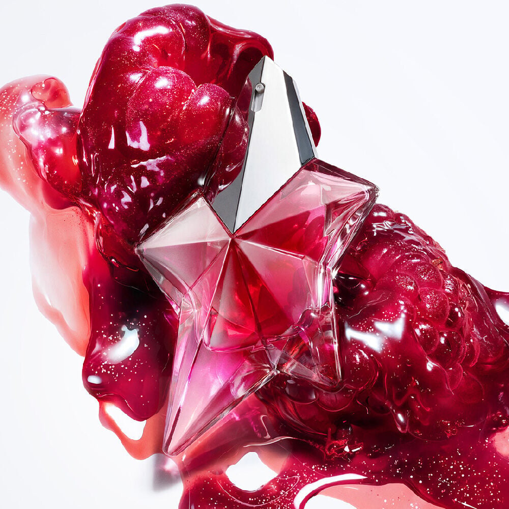 Pink Angel Nova Mugler star perfume bottle with glossy red abstract backdrop