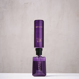 Purple Mugler Alien refill bottle connected upside down to matching perfume bottle