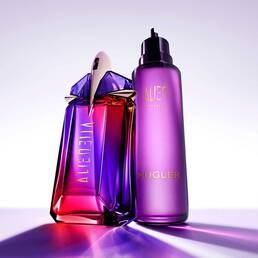 Alien Hypersense fragrance bottle in purple and pink glass beside a matching purple refill bottle, illuminated against a soft lavender background with reflective light effects.