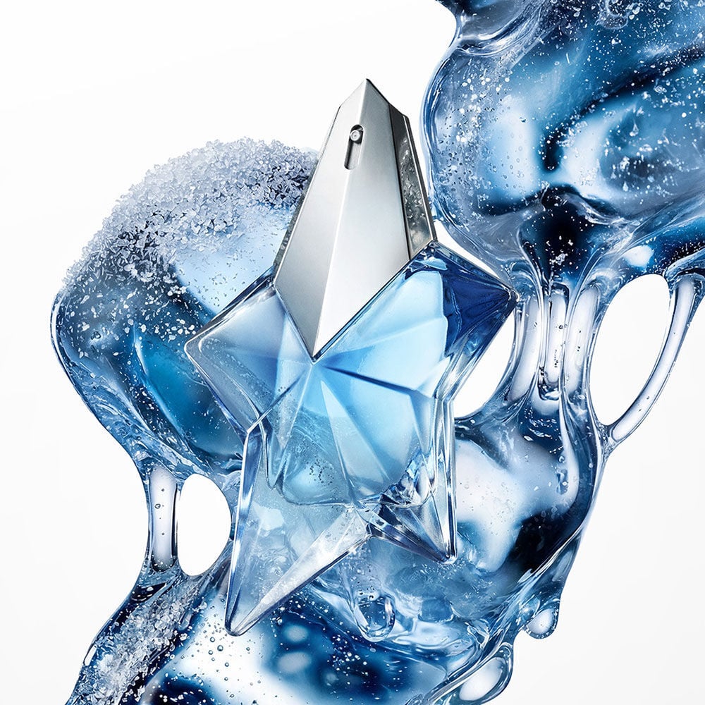 Blue Angel Mugler star perfume bottle with icy, fluid blue abstract backdrop