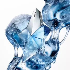 Blue Angel Mugler star perfume bottle with icy, fluid blue abstract backdrop