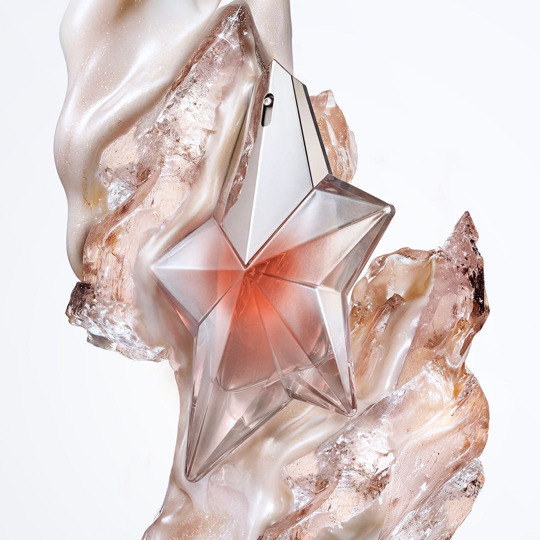Mugler Angel Blush star perfume bottle with shimmering cream and translucent crystal textures.