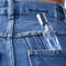 Mugler fragrance in back pocket of jeans