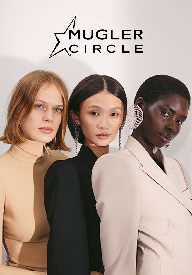 Three fashion-forward models posing for a Mugler editorial campaign banner.