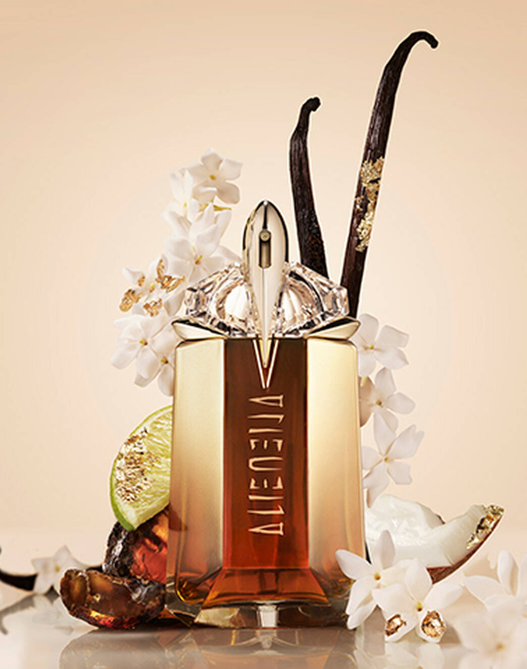 Mugler Alien Goddess Intense Eau De Parfum surrounded by flowers, bergamot, and vanilla beans