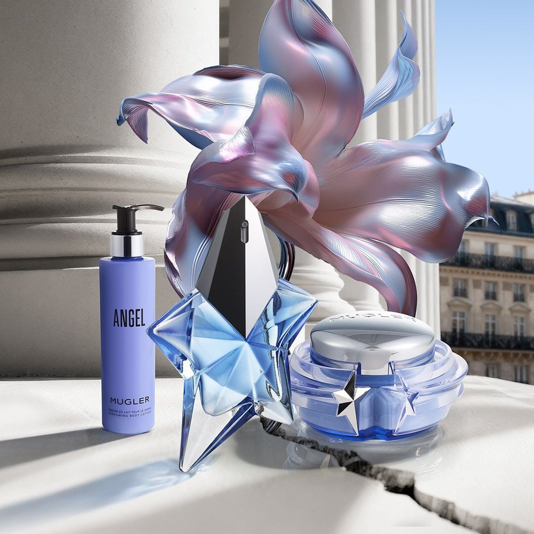 Mugler Mother's Day 2026 campaign banner featuring the iconic Angel and Alien ancillaries in a celestial floral and Parisian landscape, celebrating extraordinary mothers.