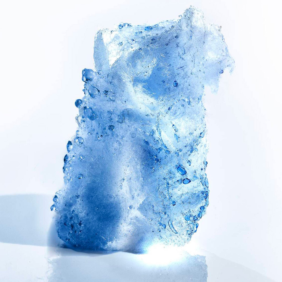 Blue crystal and mineral ingredient shot, showcasing the fresh and sparkling top notes of Mugler Angel Perfuming Shower Gel
